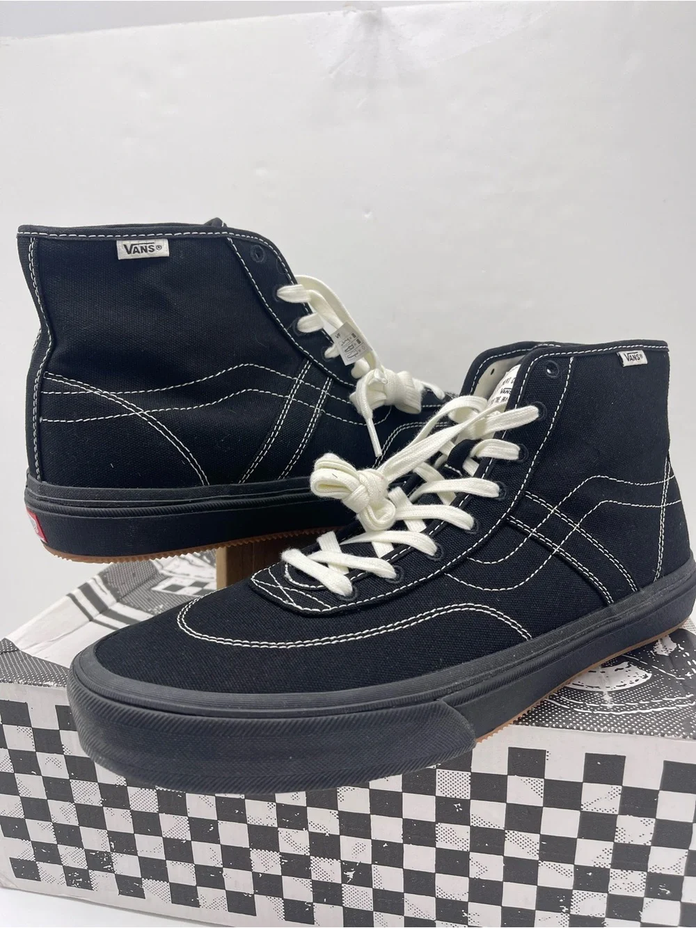 Vans Men’s High-Top Canvas Sneakers in Black and White